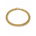 Gold tone chain bracelet on a white background
