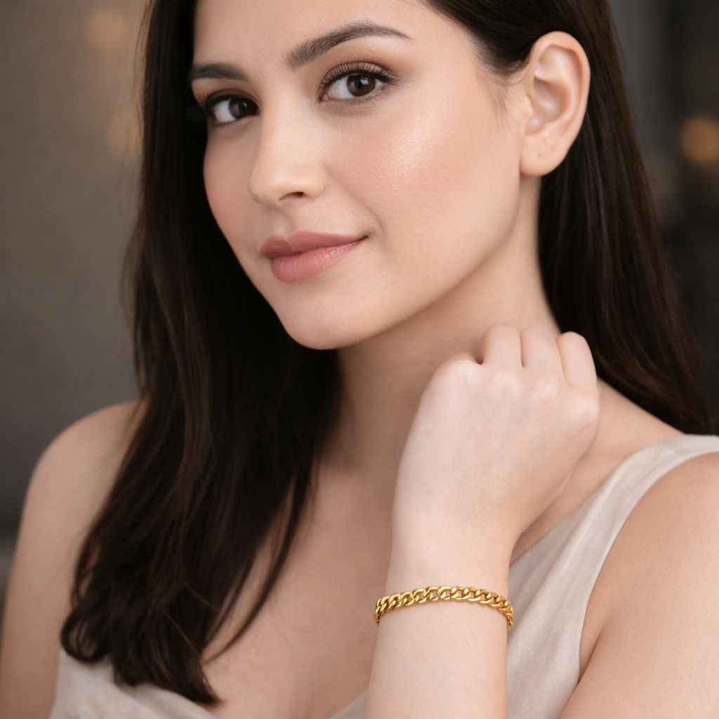 Woman wearing a gold bracelet, close-up of face and hand