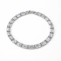 Silver bracelet with baguette-shaped crystals on a white background