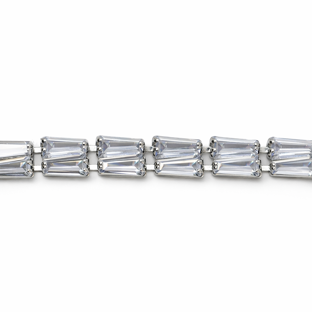 Silver bracelet with baguette-cut crystals on a white background