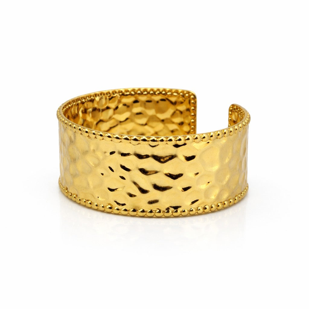 Identity gold cuff bangle with textured metal surface