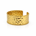 Identity gold cuff bangle with textured metal surface