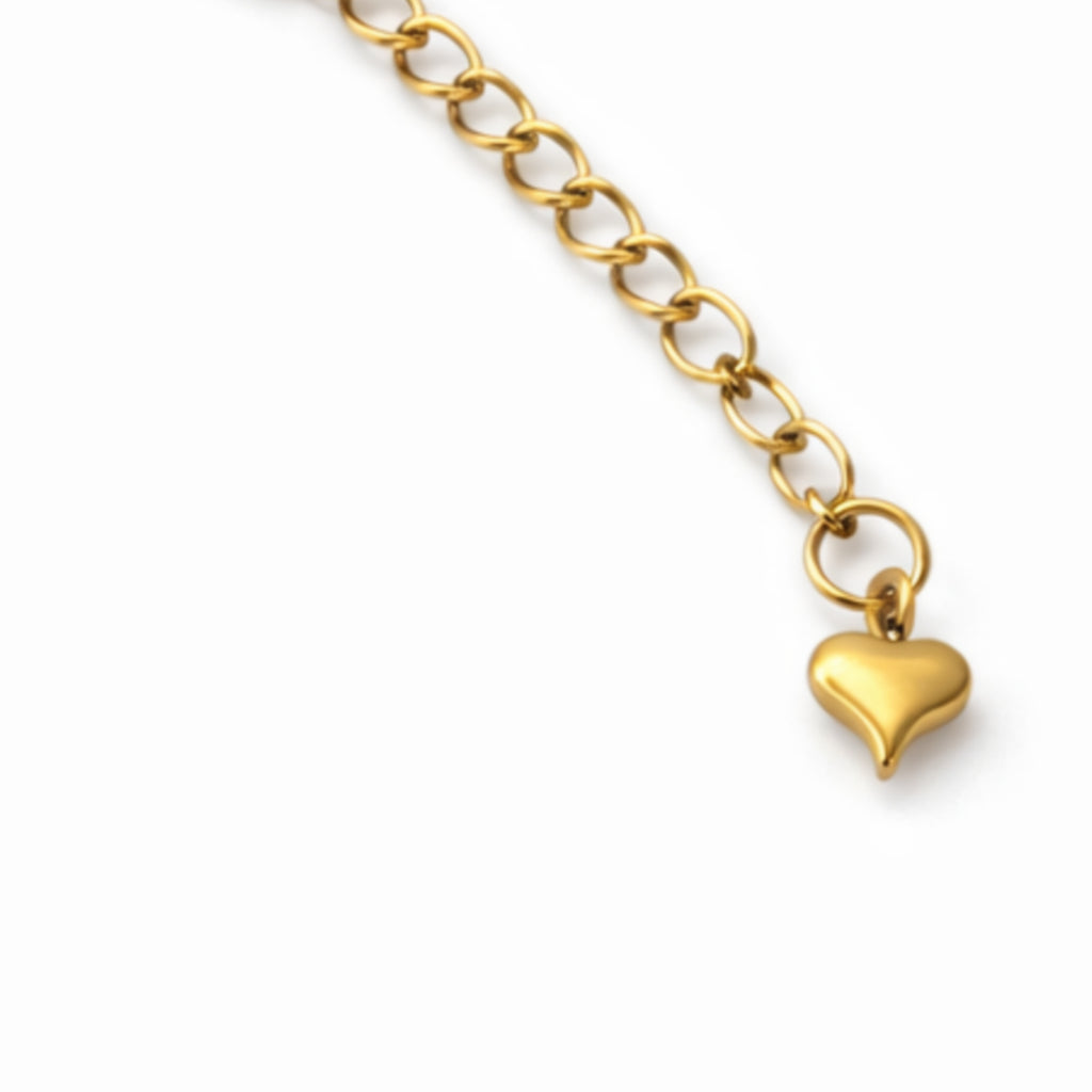 Heart charm bracelet close-up by Houses of Maher