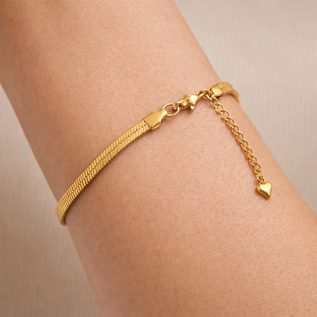 Gold bracelet for women worn on wrist with sleek chain finish
