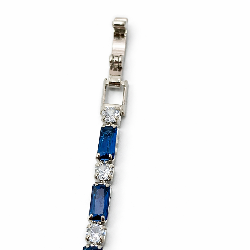 Sovereignty silver bracelet with blue and white diamond-cut stones hook