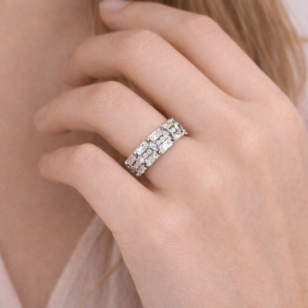 Close-up of stone ring with silver-tone finish and multi-stone face