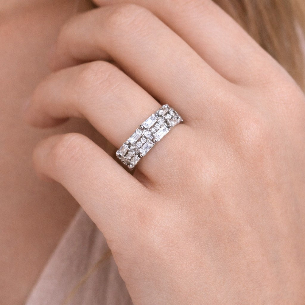 Close-up of rings for women with silver-tone band and full stone detailing on hand
