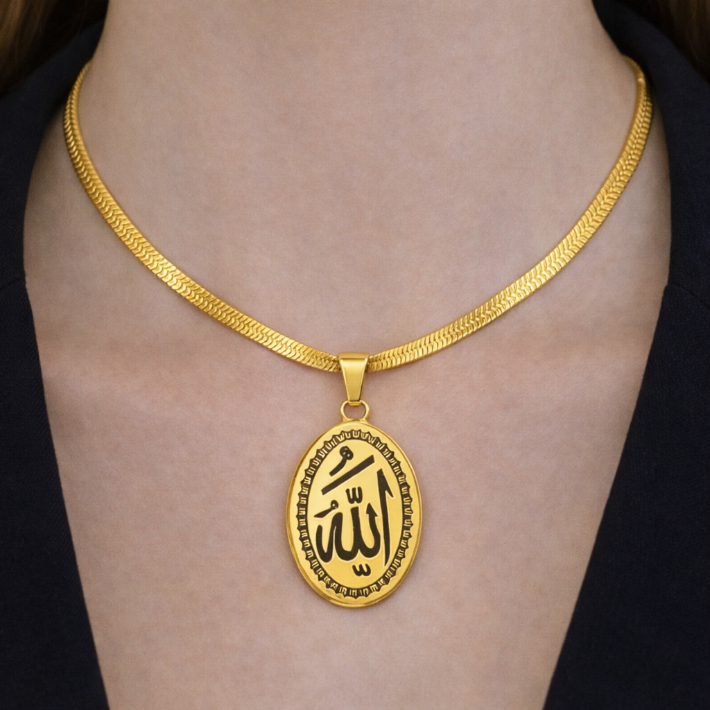 Close-up of Allah pendant worn on neckline with gold-tone chain