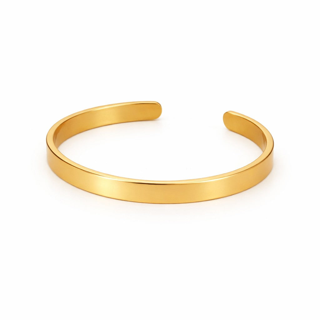 Angled view of plain gold-tone bangles for women