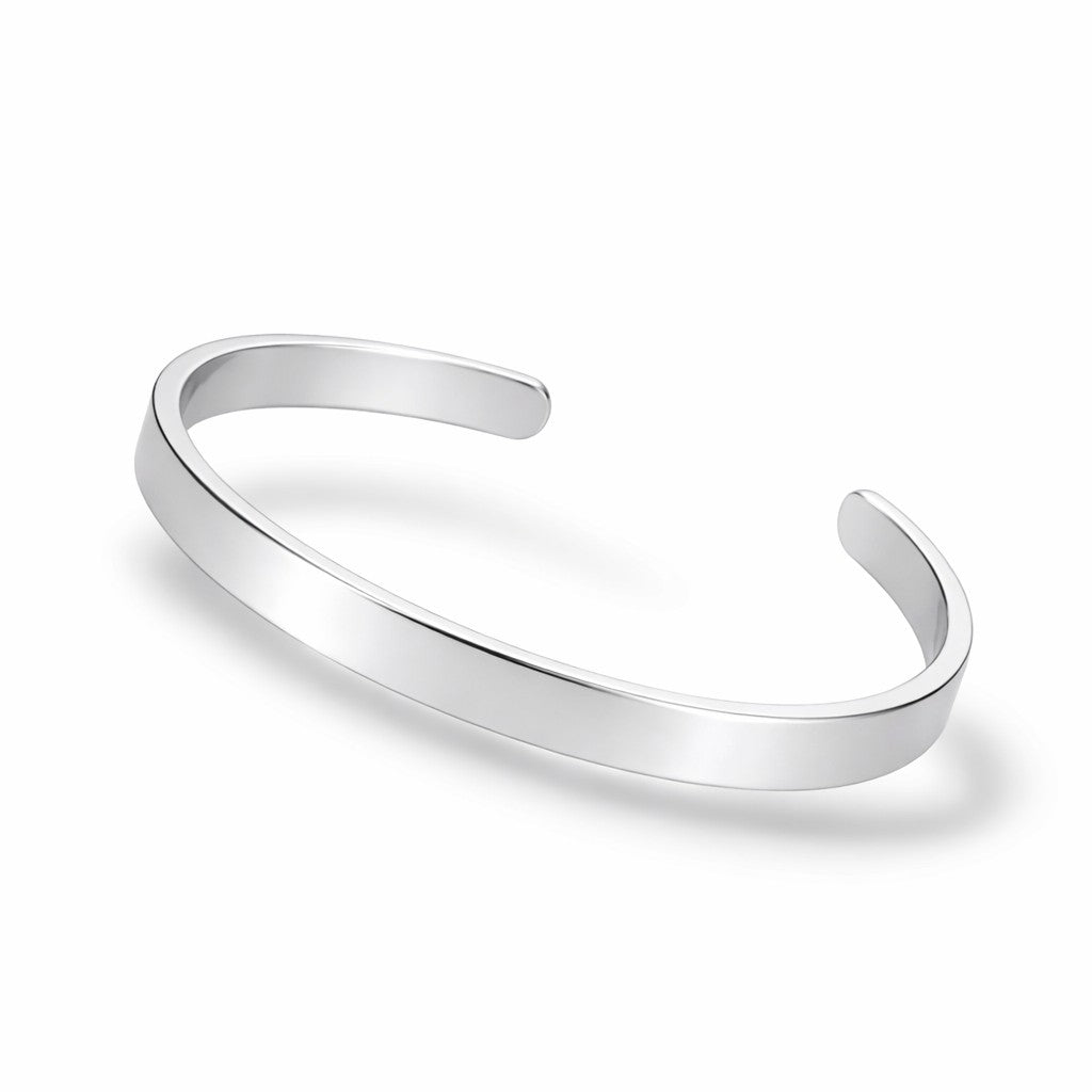 Silver open bangle on a white background