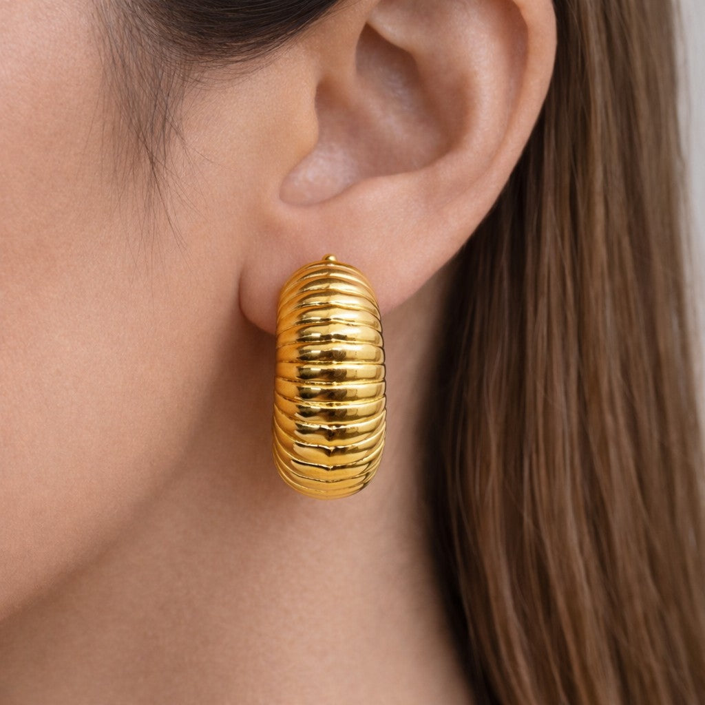 Essence Hoops gold-tone hoop earrings for women styled on model