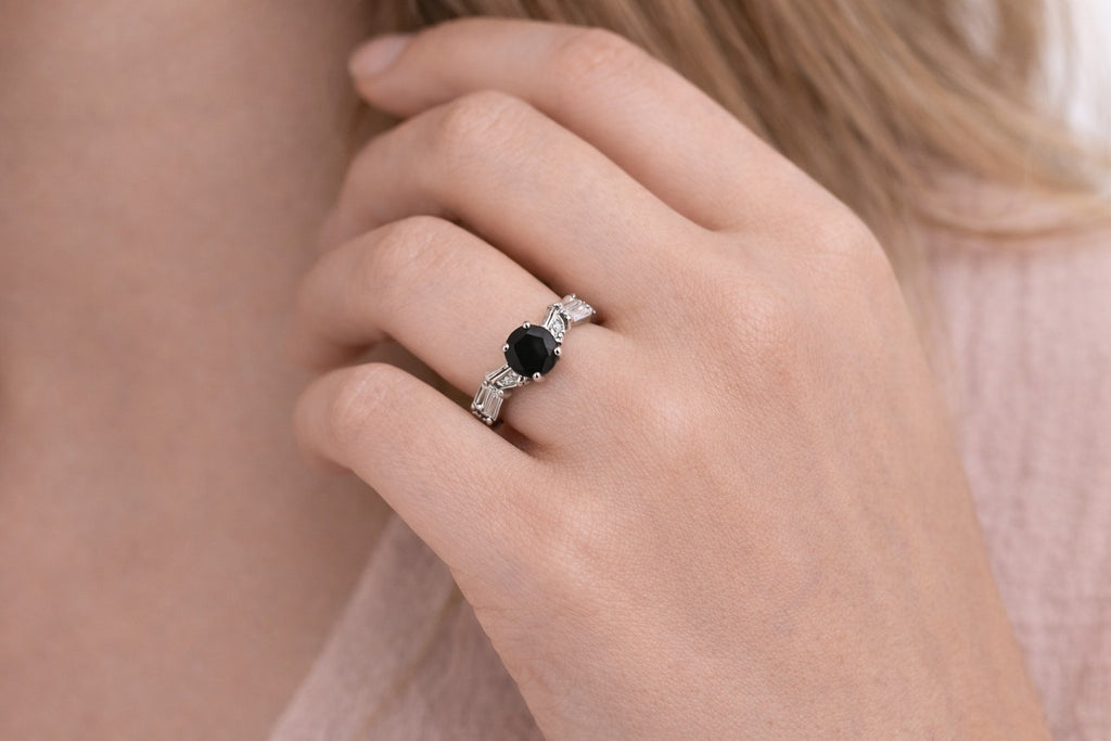 Close-up of rings for women with black stone and silver-tone finish