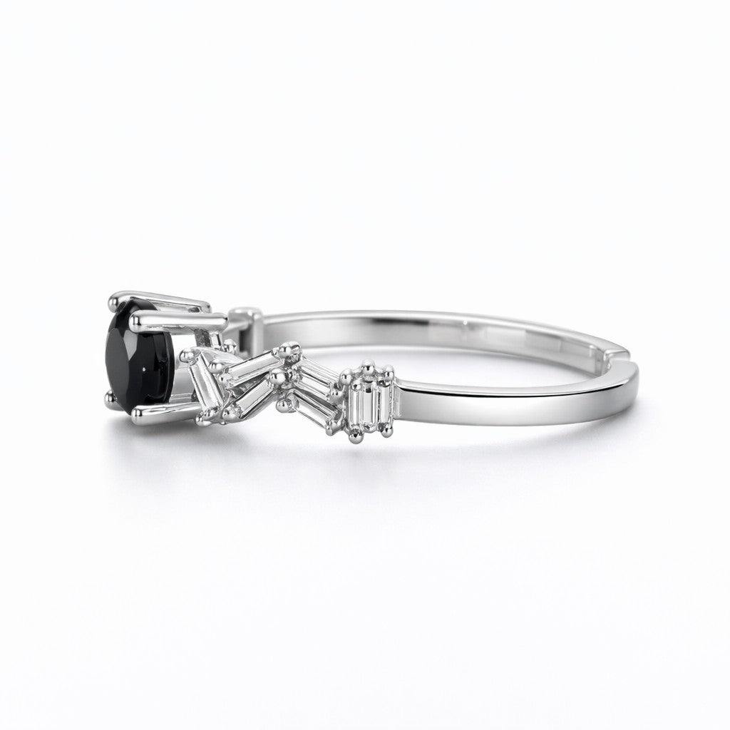 Side view of stone ring with black centre stone and open band design