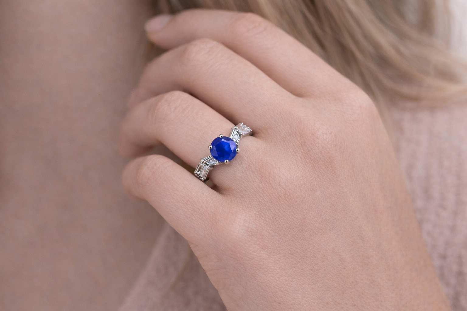 Close-up of fashion rings for women with blue centre stone and side details