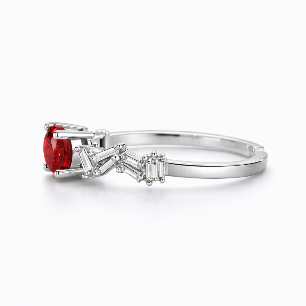 Angled view of ring design for girls with red stone and open band