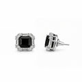 Pair of black stud earrings for women on white background