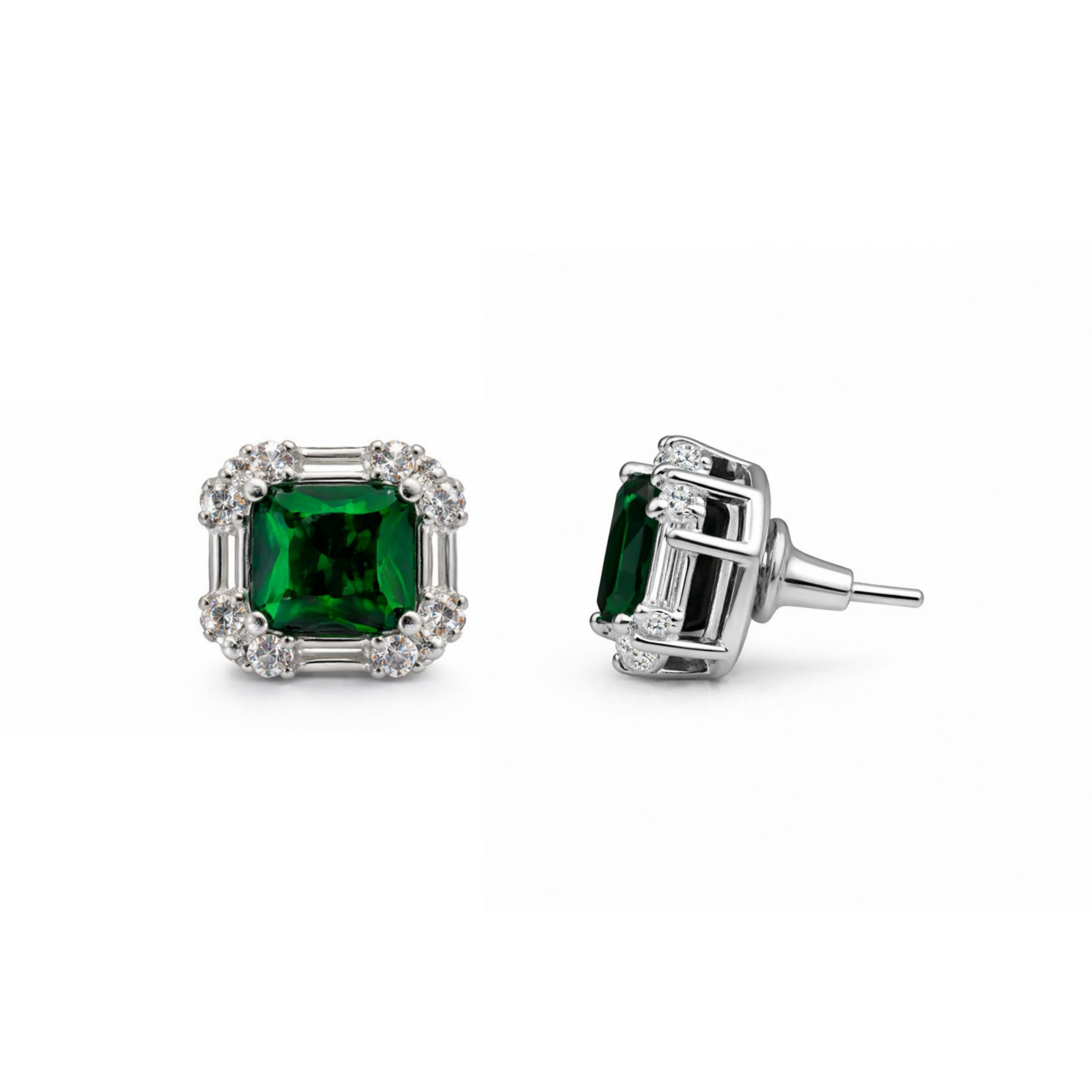 Pair of emerald green gemstone earrings with silver settings on a white background