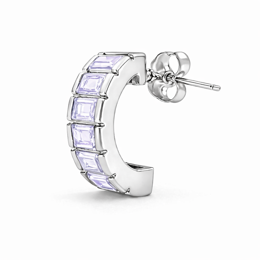 Silver hoop earring with purple gemstones on a white background