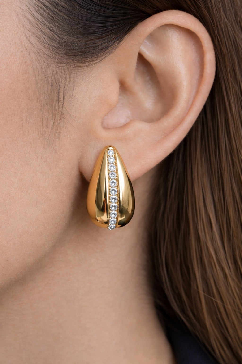 Gold earrings for women from the Intuition Earrings range worn on model