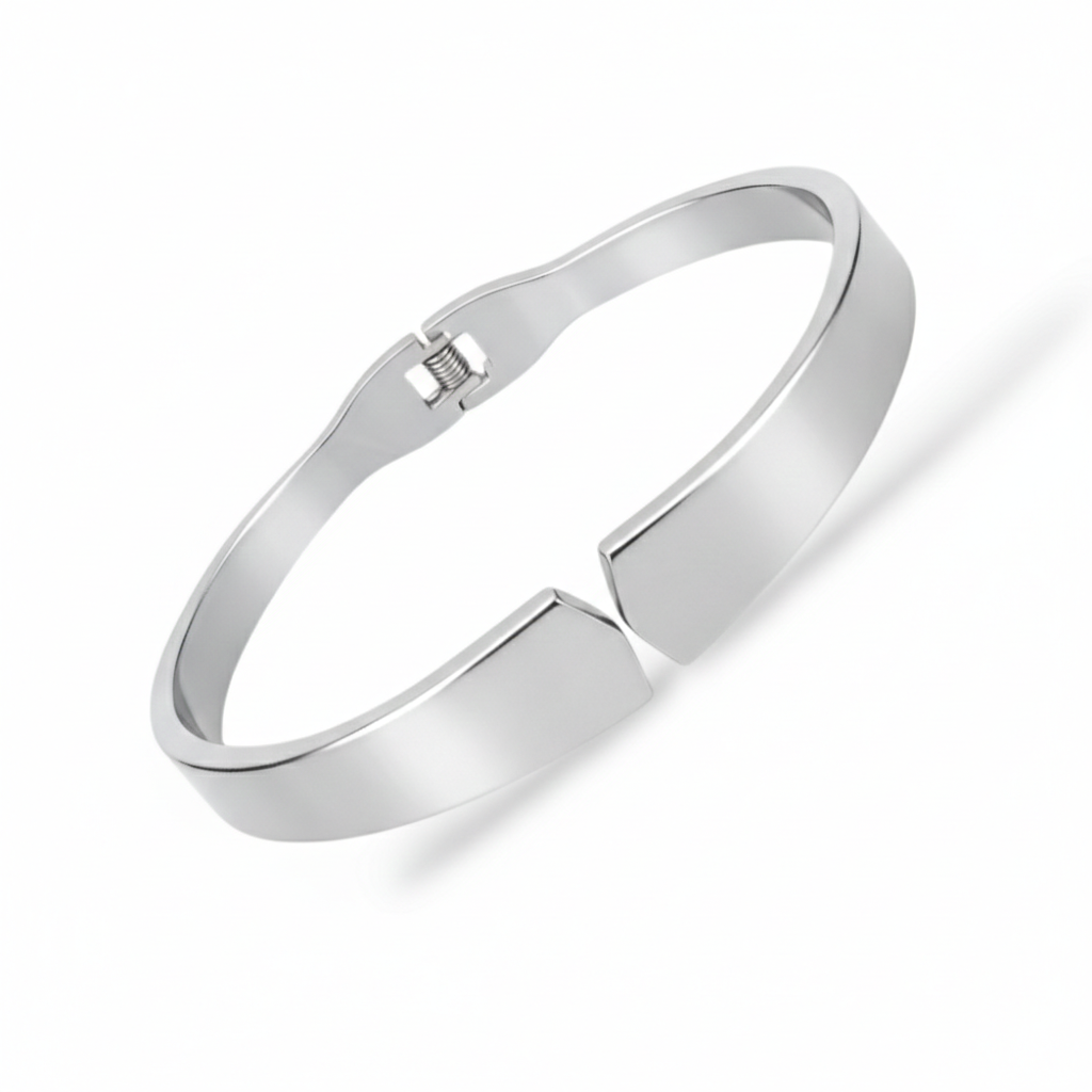 Angled view of bangles with smooth silver-tone surface and magnetic design