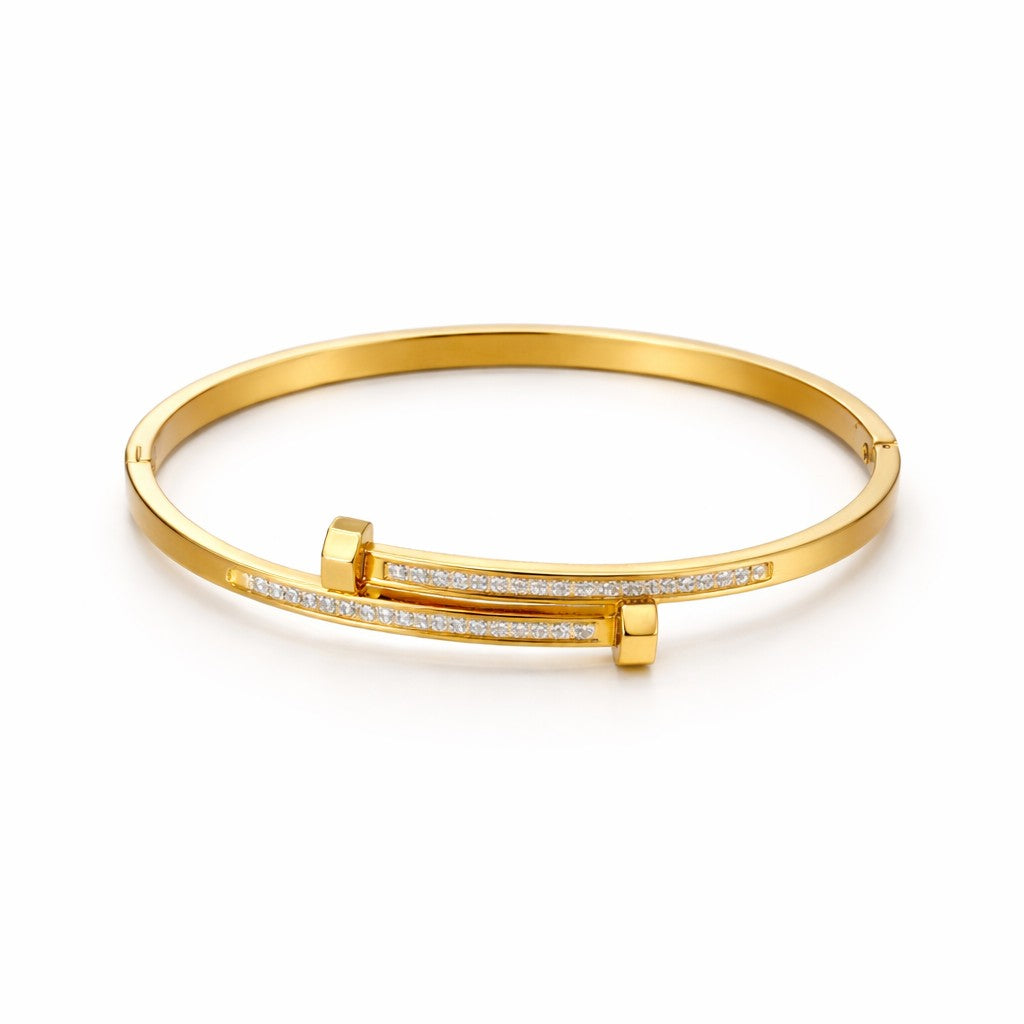 Front view of artificial bangles with gold-tone nail-inspired design and white stones