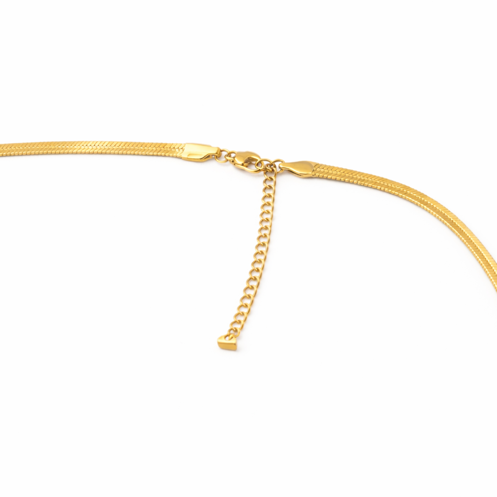 Clasp detail of necklace with smooth gold-tone snake chain