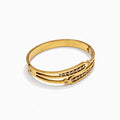 Front angled view of bangles with gold-tone finish and stone accents