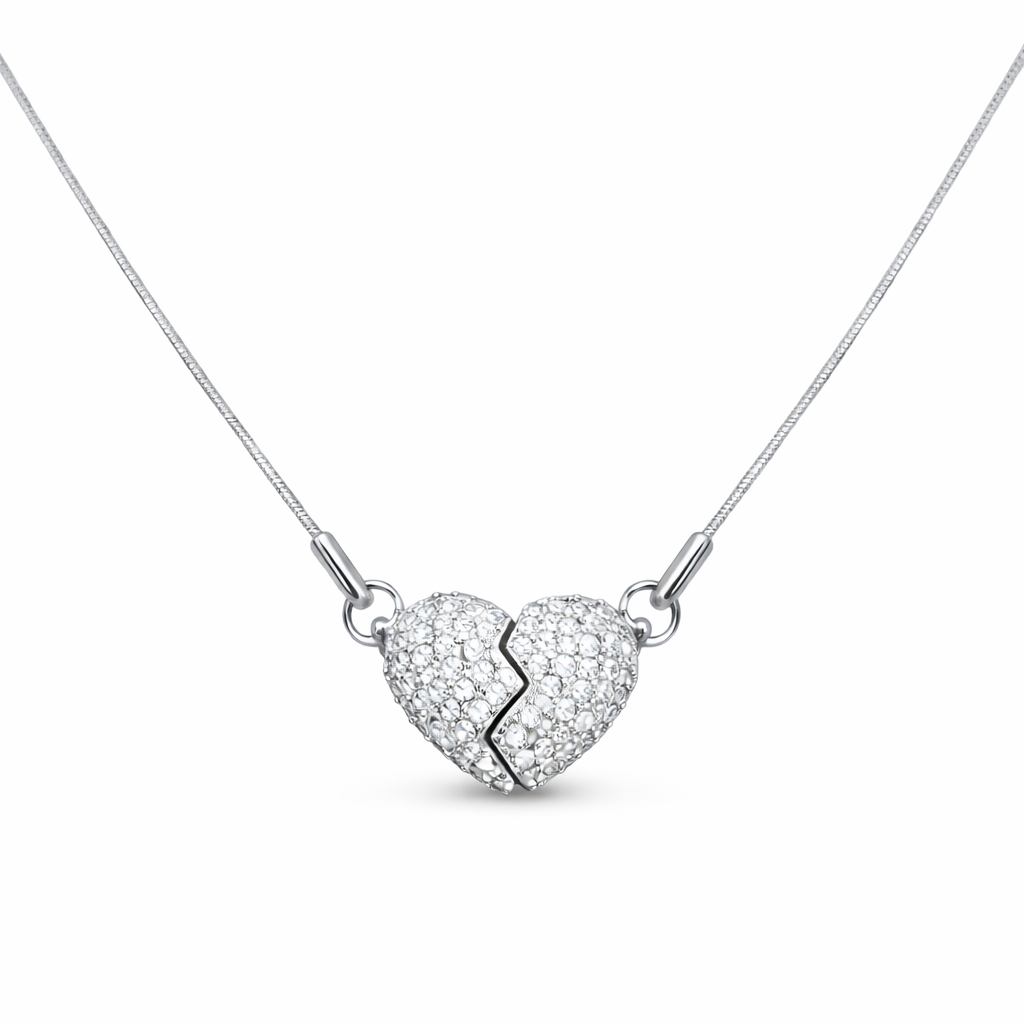 Full view of heart necklace with silver-tone chain and stone-studded charm