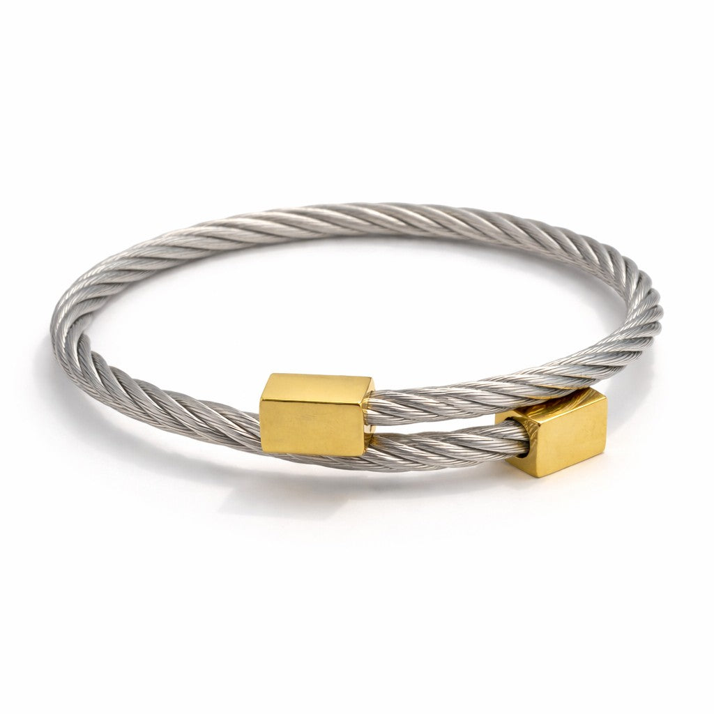 Front view of artificial bangles with silver band and gold-tone accents