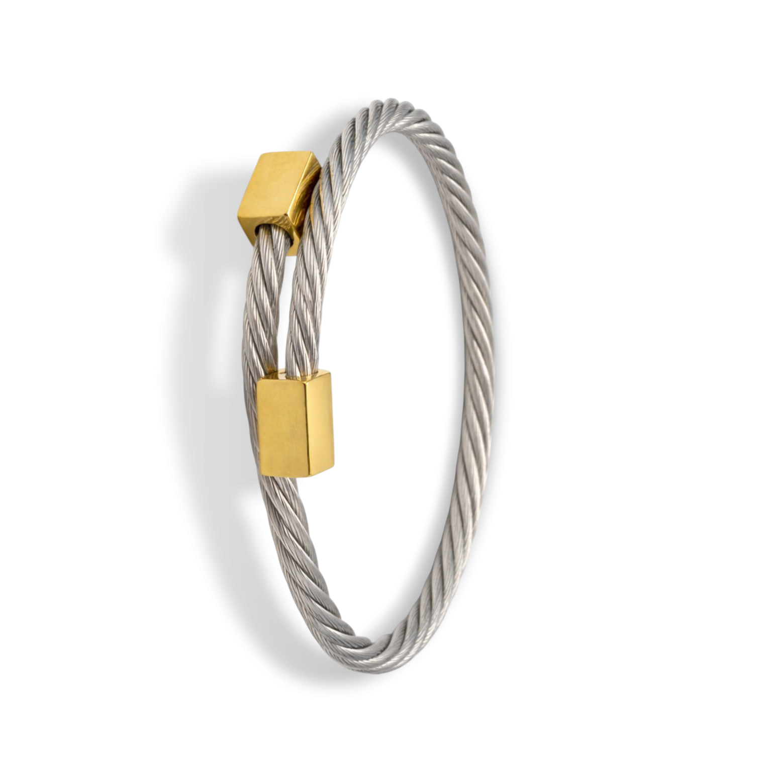 Top view of bangle bracelet with polished silver band and gold-tone accents