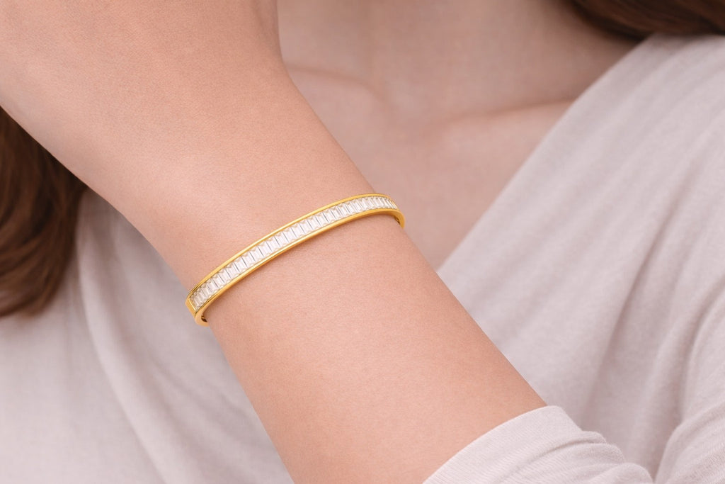 The Calling Bangle worn as bangles for women with a polished gold-tone look